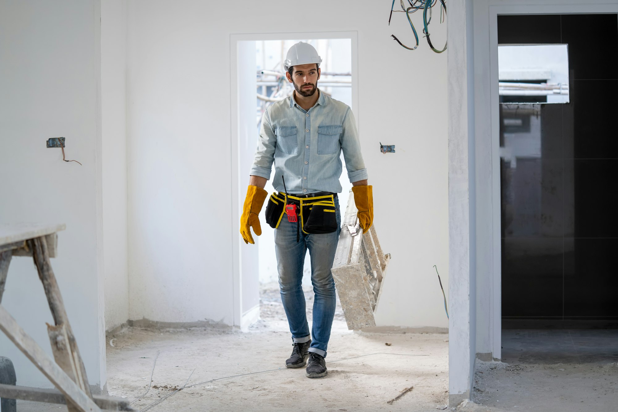 Electrician working working on building site, Repair and handyman concept.